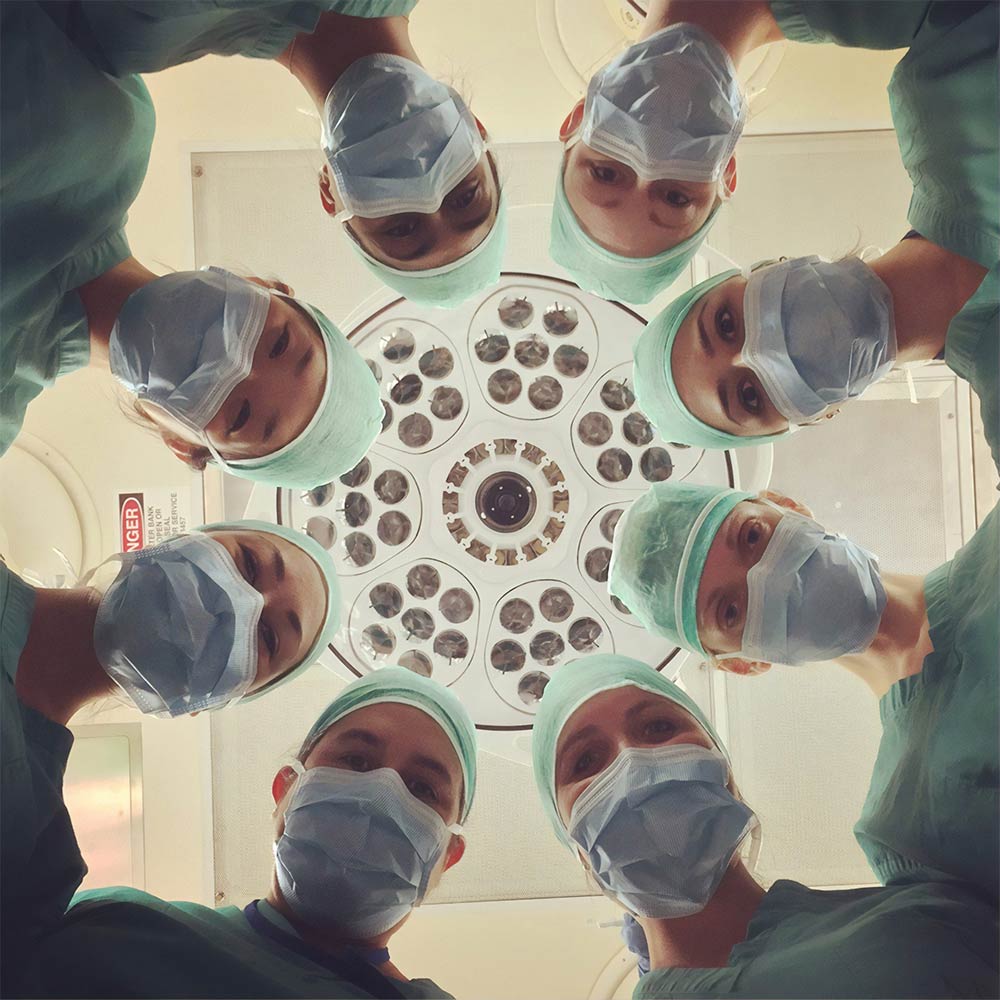 Surgeons Staring Down Camera Lens